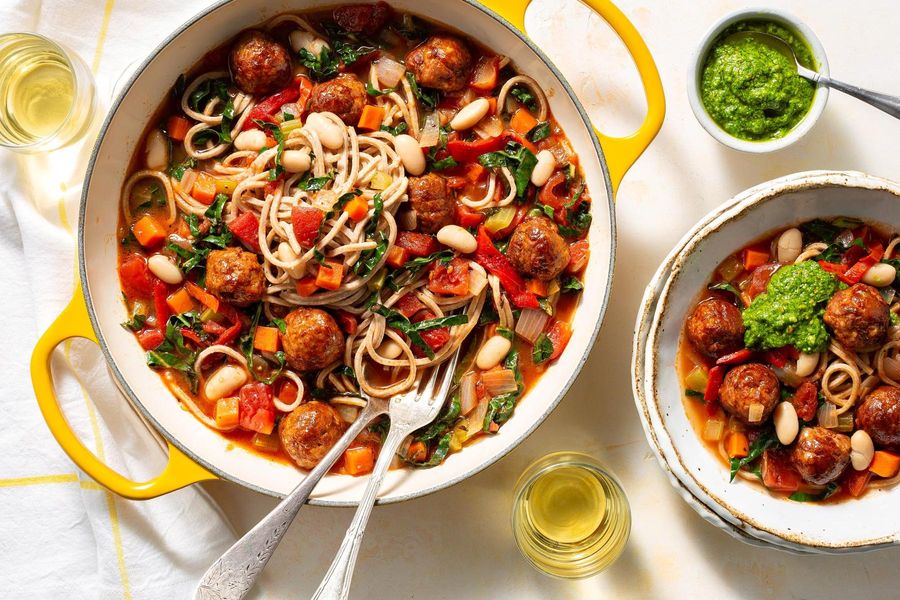 Chorizo meatball soup with kale and arugula-pistachio pesto