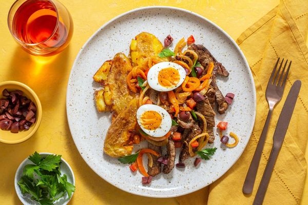Sausages with smashed potatoes and warm Tunisian mechouia salad