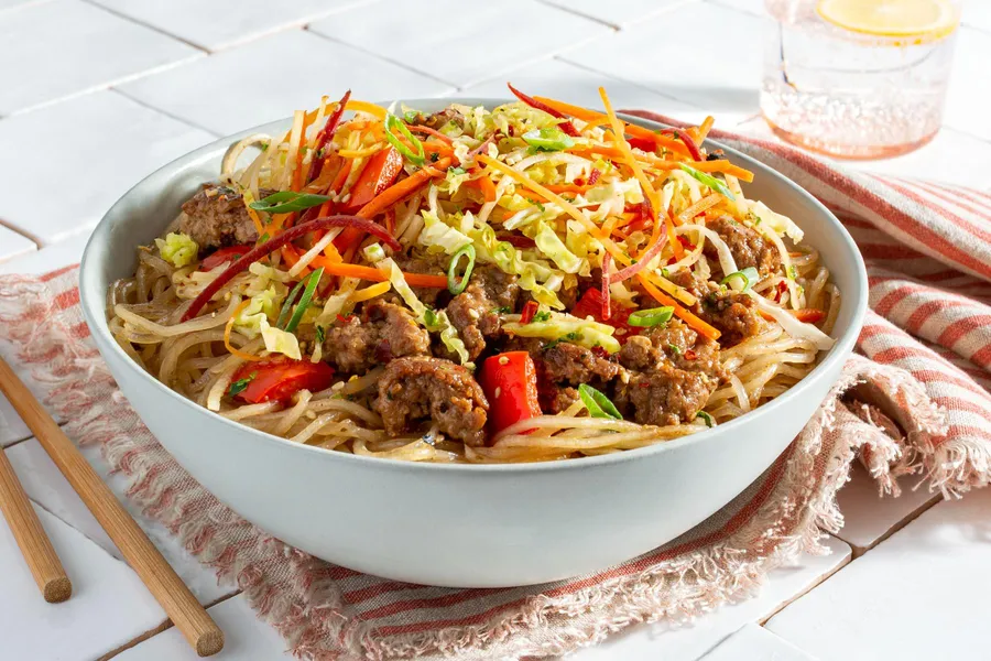 Sichuan glass noodle bowl with pork, cabbage, and carrots