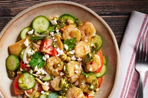 Shrimp fattoush salad with spicy green harissa, chickpeas, and pita