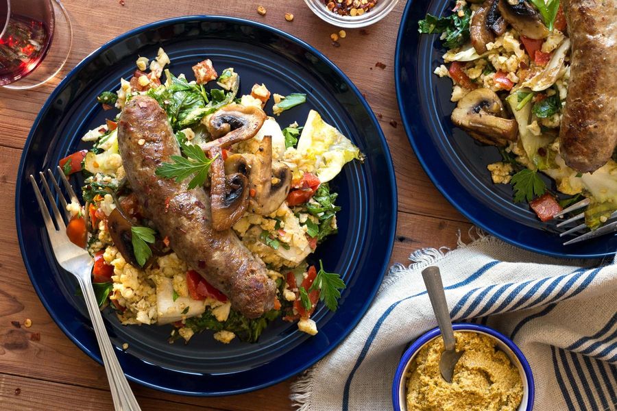 Italian sausages with warm cauliflower salad and artichoke romesco