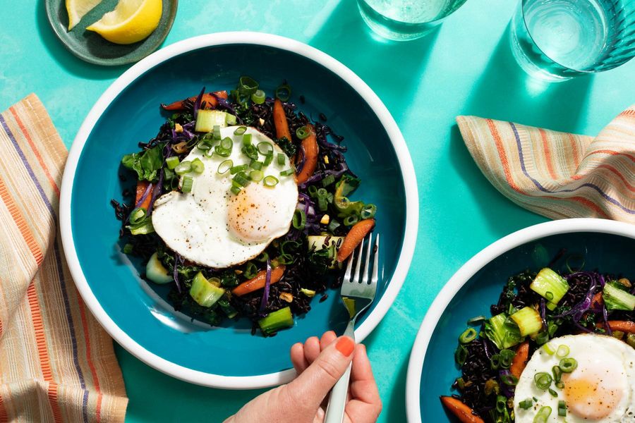 Superfood stir-fry with bok choy, black rice, and fried eggs