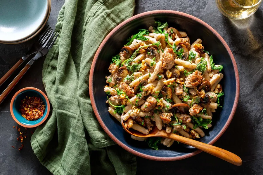 Fresh ricotta cavatelli with sausage, mushrooms, and walnuts Available with Italian pork sausage or chicken sausages