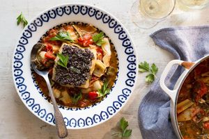 Tomato-braised cod with chard, artichokes, and olive relish