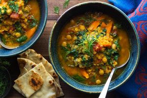Chickpea and red lentil dal with kale and warm naan