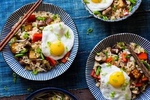 Fried rice with braised tofu, green beans, and sunny-side up eggs