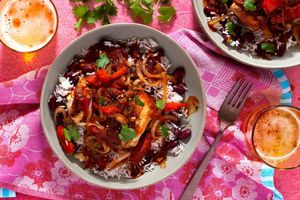 Belizean stewed chicken over coconut rice and beans