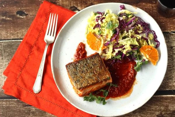 Seared salmon in chraimeh sauce with winter slaw