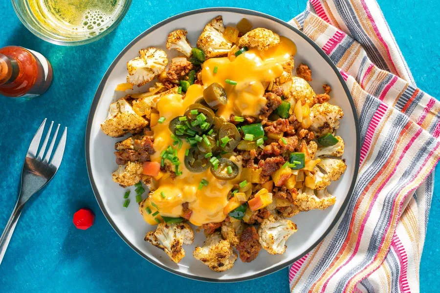 Chorizo and poblano hash with chile-lime cauliflower and cheese sauce