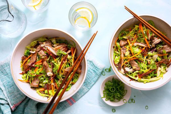 Pork egg roll in a bowl with stir-fried vegetables