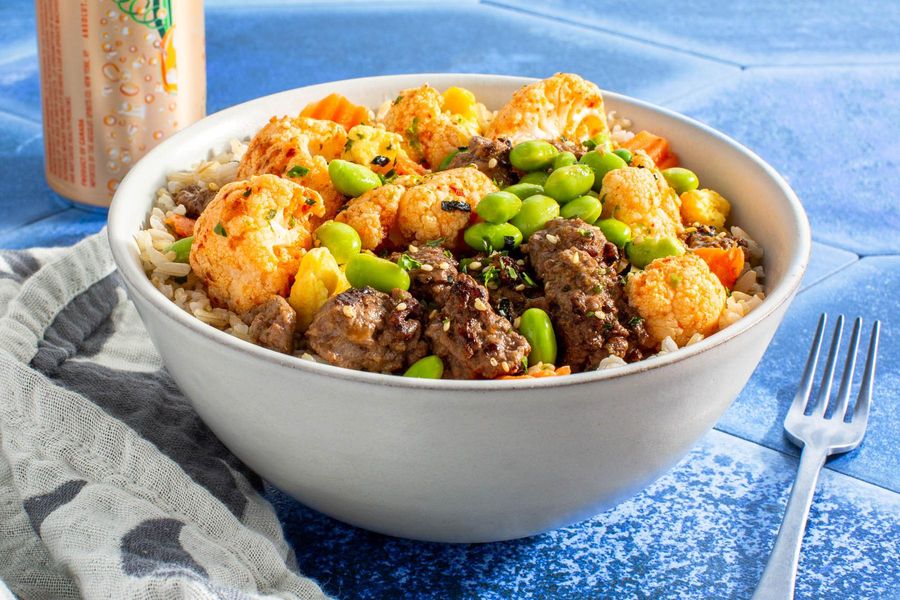 Beef donburi rice bowl with edamame and kimchi-lime vegetables