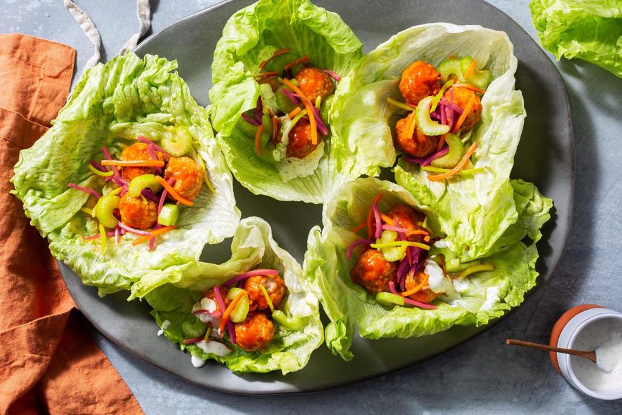 Turkey meatball lettuce cups with Buffalo sauce and carrot slaw