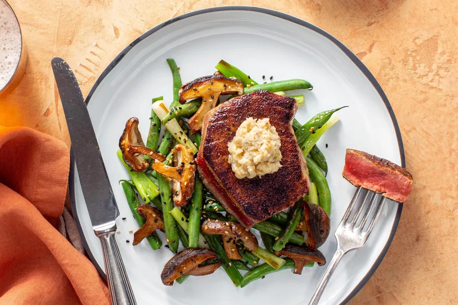 Seared tuna with roasted garlic–miso butter, green beans, and shiitakes