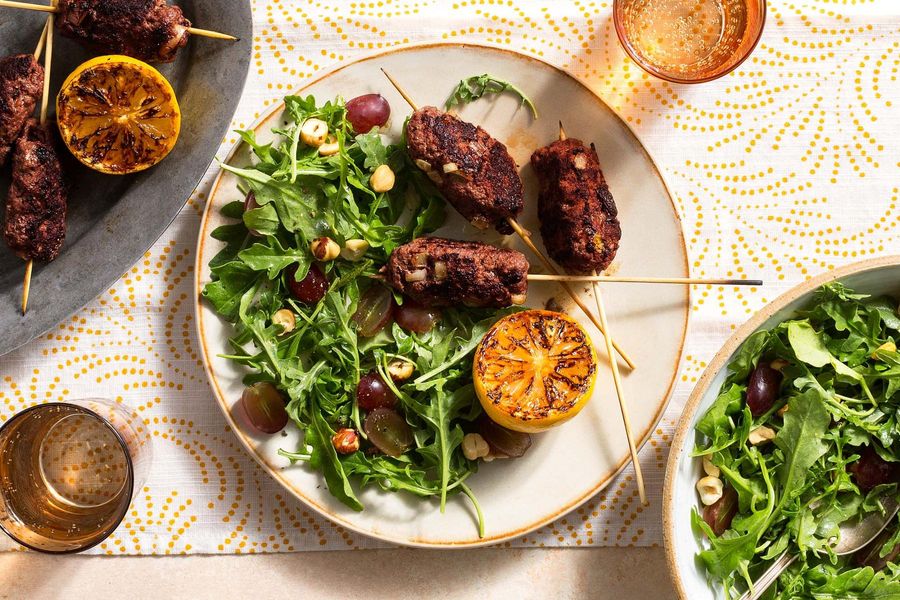 Greek souzoukaklia skewers with arugula-grape salad