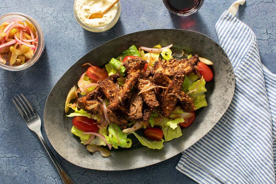 A salad inspired by a pastrami sandwich with your choice of protein