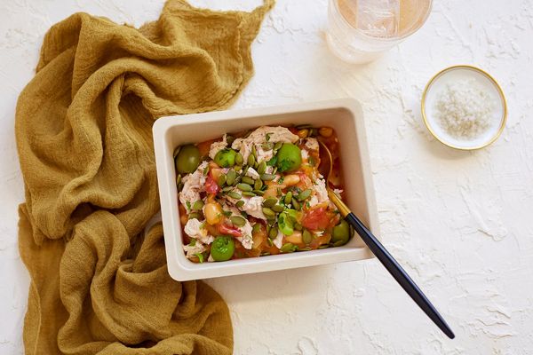 Latin-style chicken stew with green olives and pumpkin seeds