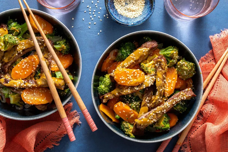 Steak stir-fry with broccoli, carrots, and sesame seeds