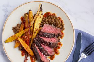 Seared steaks with lentils, harissa, and spicy honey carrots