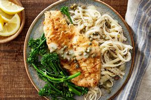 Pan-seared tilapia piccata over linguine with baby broccoli