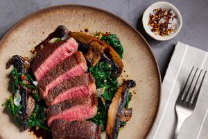 Black Angus steaks with balsamic glaze, portobellos, and garlicky spinach