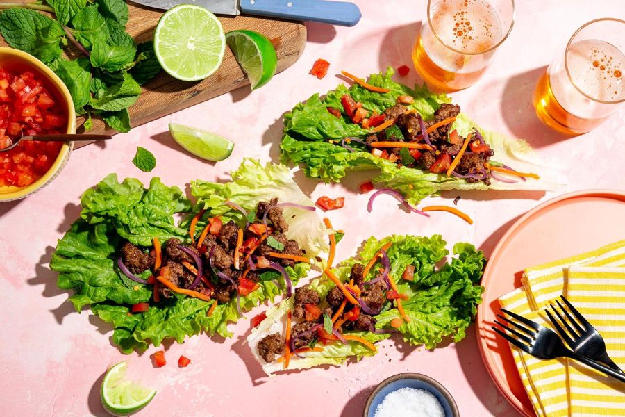Larb lettuce cups with carrots, tomato, and fresh mint