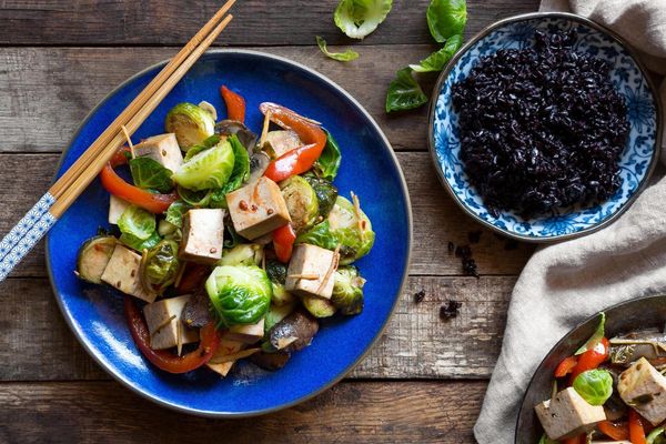 Tofu stir-fry with Brussels sprouts, cremini mushrooms, and black rice
