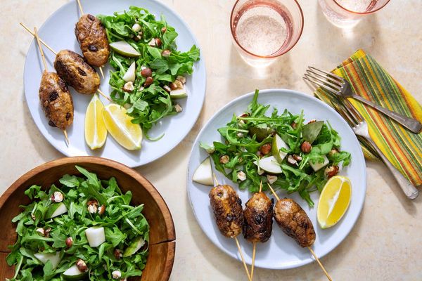 Greek beef skewers with arugula-pear salad and hazelnuts