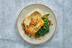 Seared Alaskan halibut with mashed potatoes & herbed brown butter-parmesan sauce