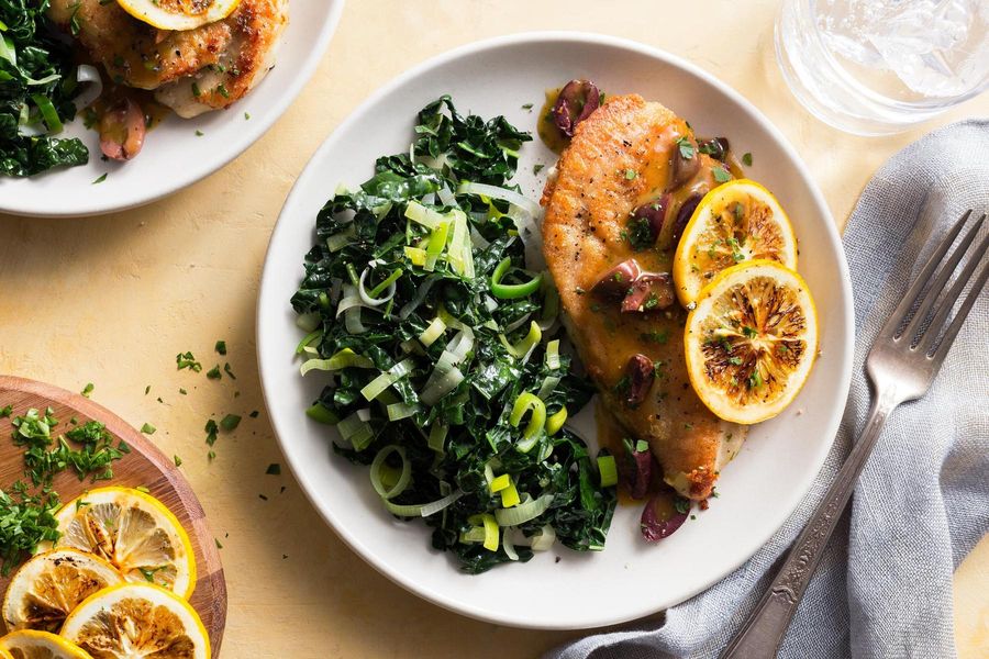 Chicken scallopini with lemon-olive sauce and sautéed greens