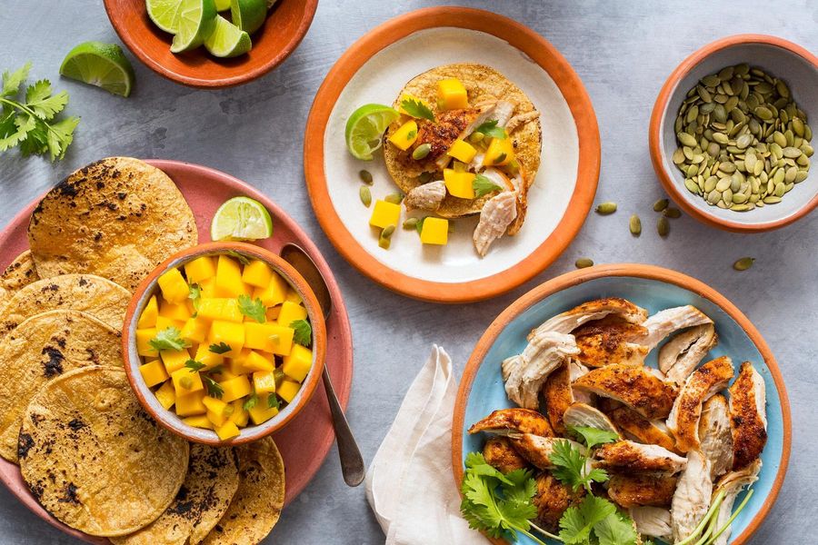 Smoky shredded-chicken tacos with mango salsa