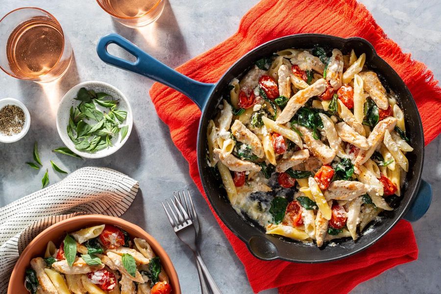 Creamy penne rigate with baked chicken, feta, and cherry tomatoes