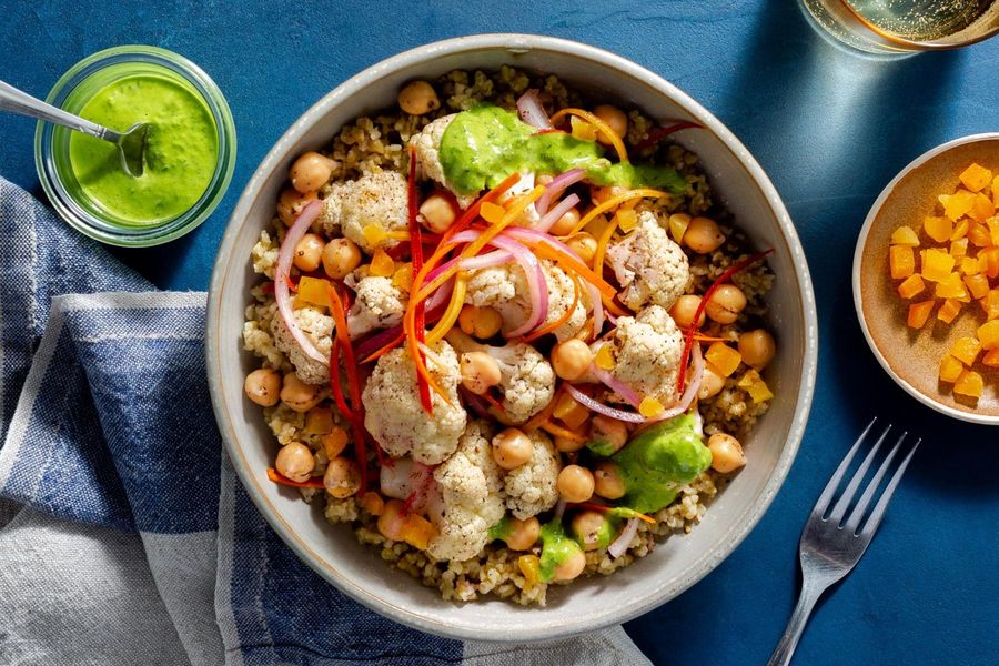 Middle Eastern chickpea and freekeh grain bowl with herb yogurt