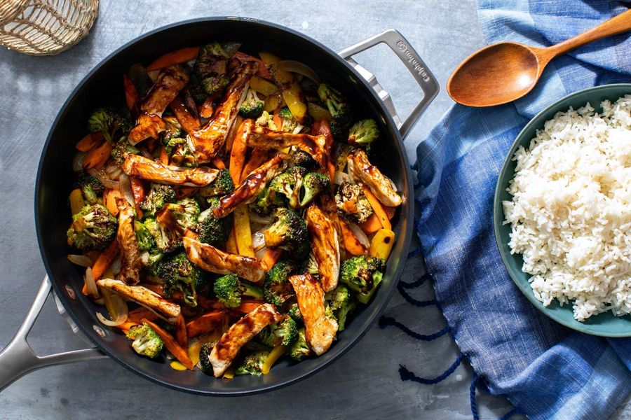 Hot and sour chicken stir-fry with vegetables and long-grain rice