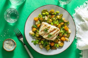 Seared halibut over butter bean, edamame, and tomatillo succotash