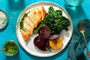 Chicken breasts and parsley-pecan pesto with roasted beet and orange