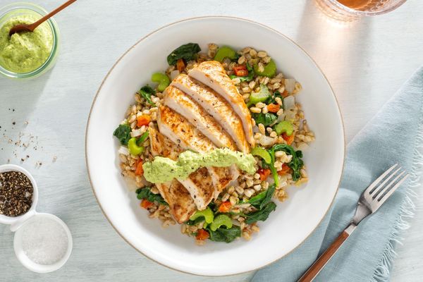 Salmon farro bowls with spinach and tahini goddess dressing