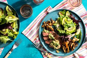 Black Angus steaks with mushrooms, mustard pan sauce, and kiwi salad