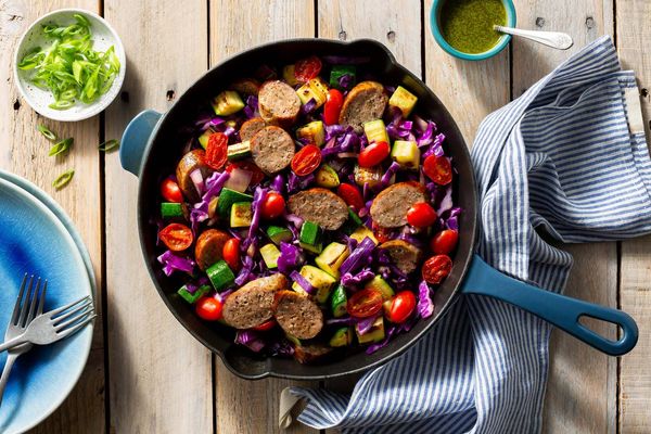 Italian sausage and vegetable skillet with spicy green harissa