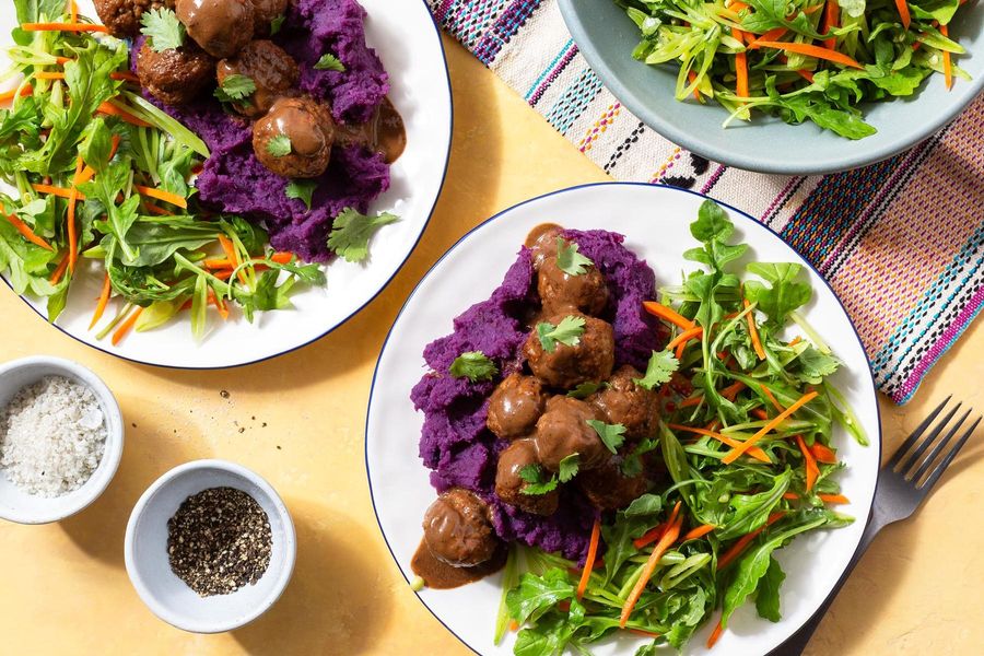 Turkey meatballs in black garlic–tahini sauce over sweet potato mash