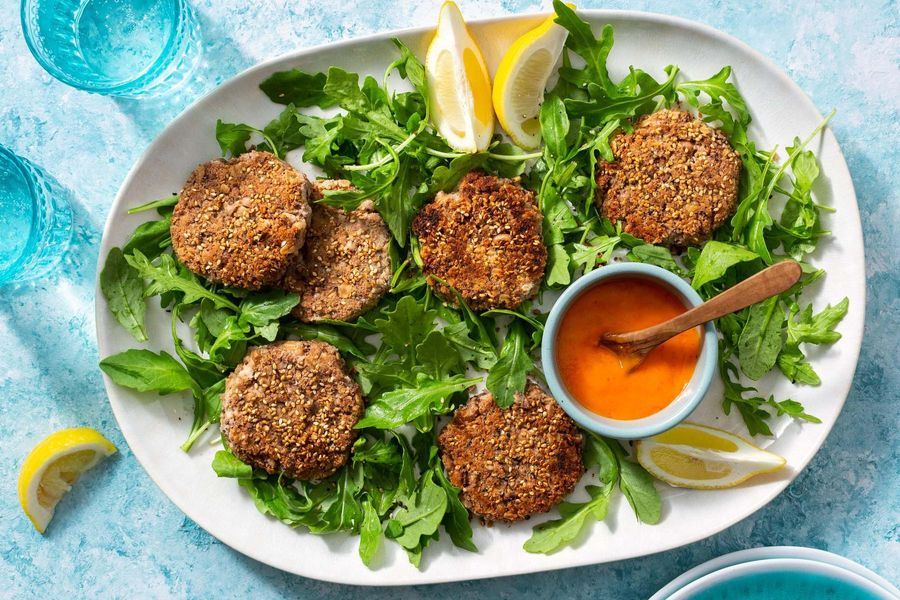 Black-eyed pea fritters with arugula and spicy chile-mango sauce