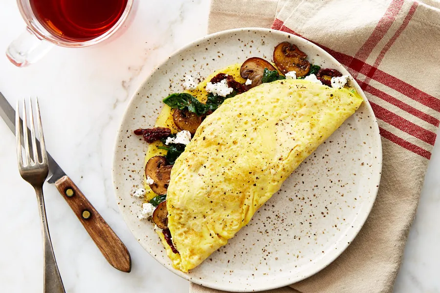 Spinach and Mushroom Omelette with Sun-Dried Tomato Pesto and Goat Cheese