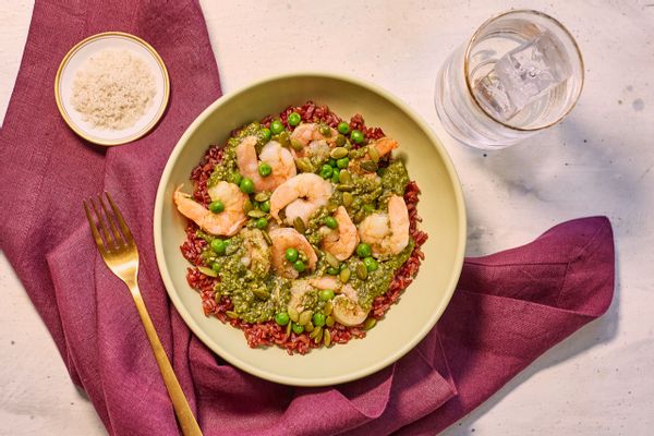 Shrimp mole verde with red rice, sweet peas, and pumpkin seeds