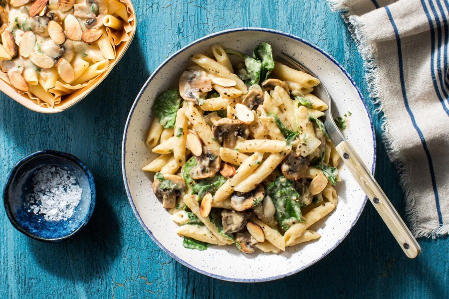Creamy mushroom penne with baby spinach and almonds
