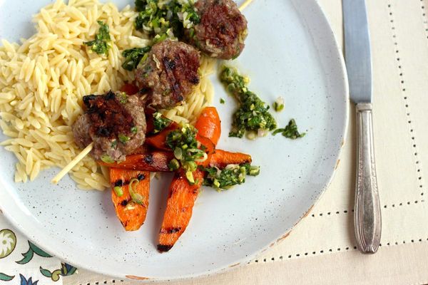 Lamb sausage with lemon orzo and mint chutney
