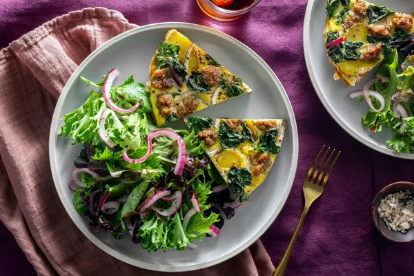 Chorizo, chard, and potato frittata with mixed green salad