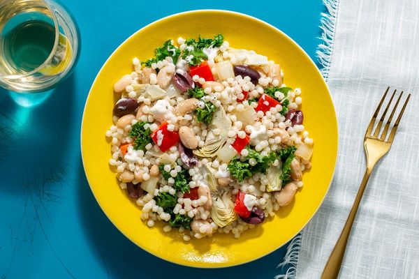 Vegetarian couscous with artichokes, olives, and creamy feta dressing