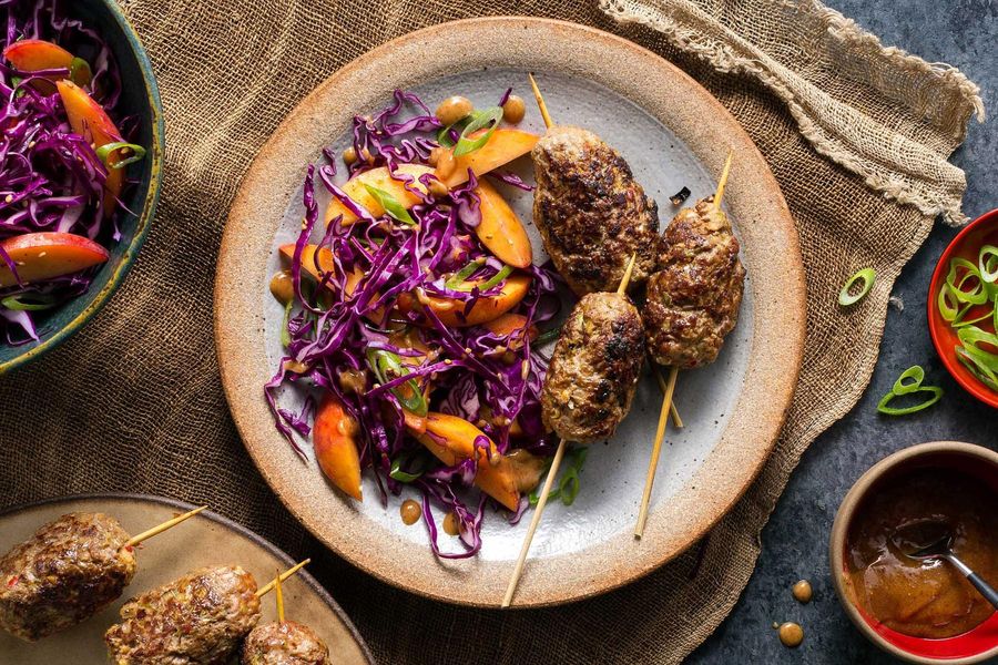 Korean skewers with your choice of protein and sesame-cabbage slaw