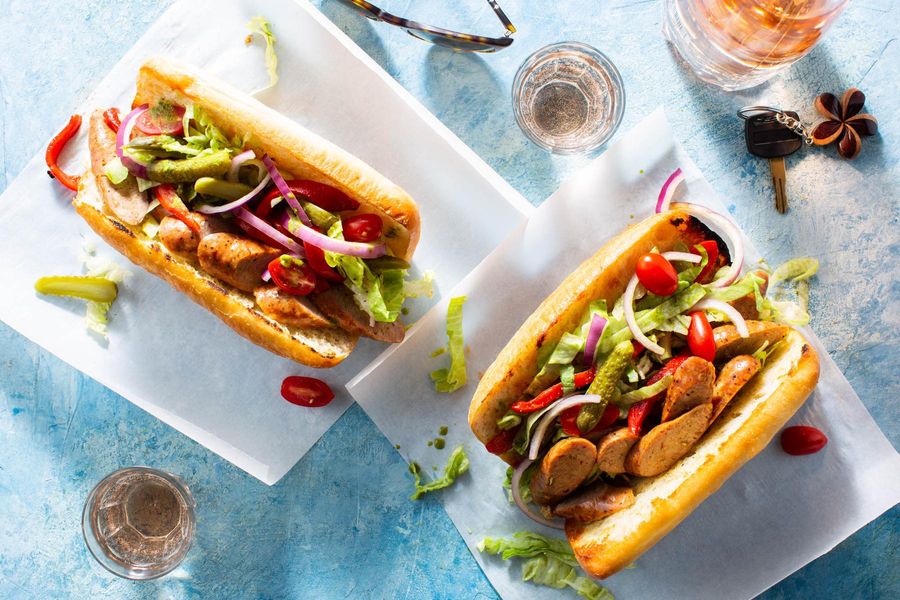 Italian sausage sandwiches with roasted red pepper salad and cornichons