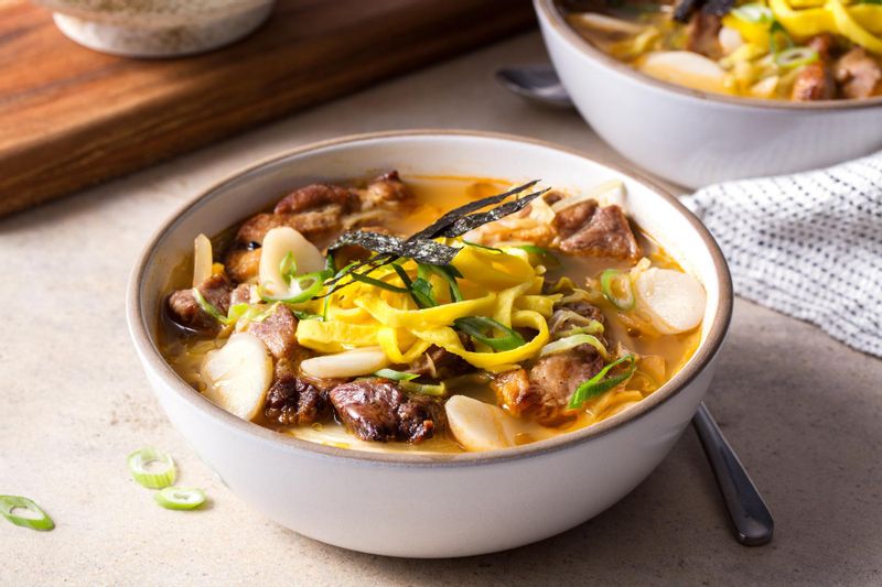 Tteoukguk Korean rice cake soup with pork, egg, and kimchi Sunbasket