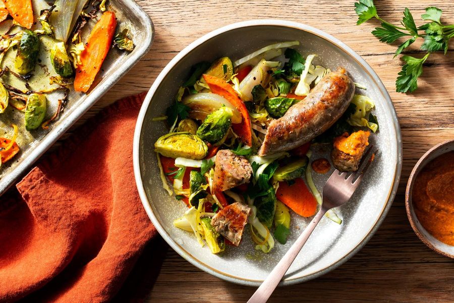 Roasted Italian sausages and spiced vegetables with romesco